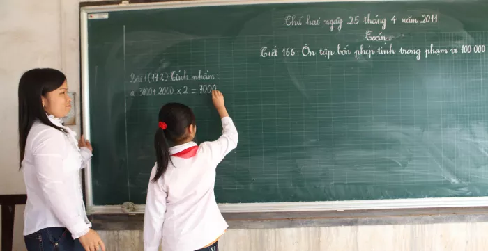 A student and her teacher in primary school