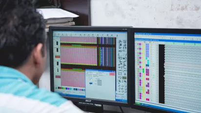 Male worker in front of a computer in Colombia